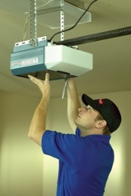 Image of installer servicing a garage door